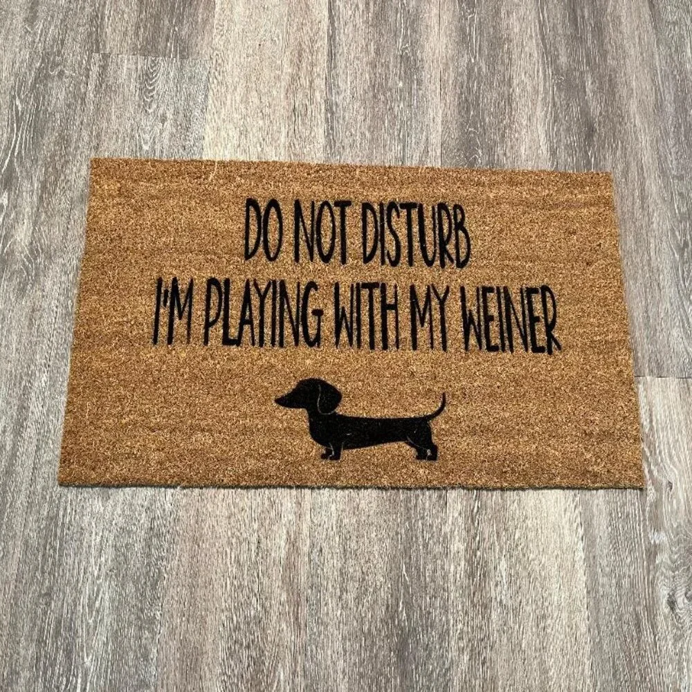 Playing with my Weiner decorative coir doormat